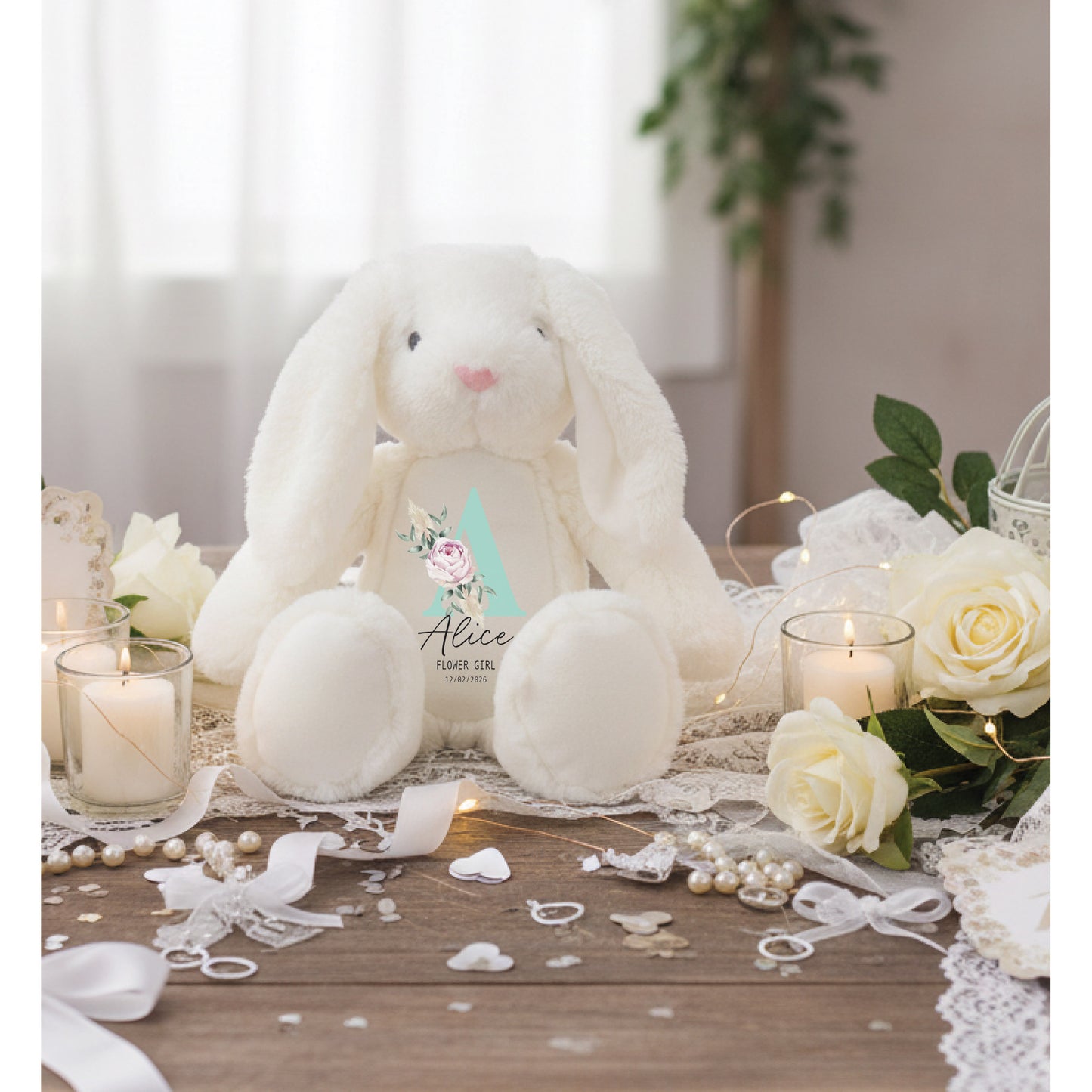 White plush bunny with decorative items on a wooden table