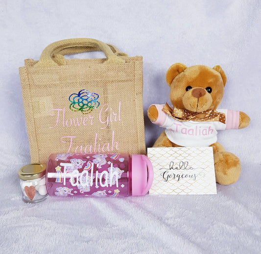 Contents of personalised flower girl gift set laid out showing each item included in the set