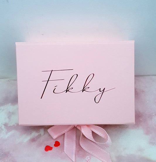Contents of luxury graduation pamper box showing natural vegan products and personalised card