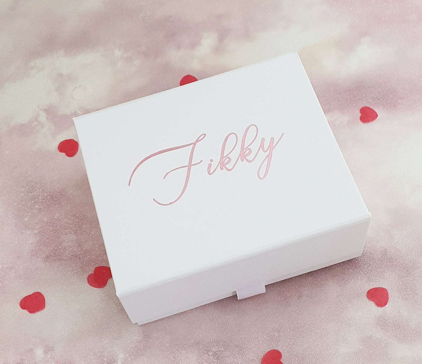 Contents of rose gold luxury pamper gift box showing vegan bath products and personalised card