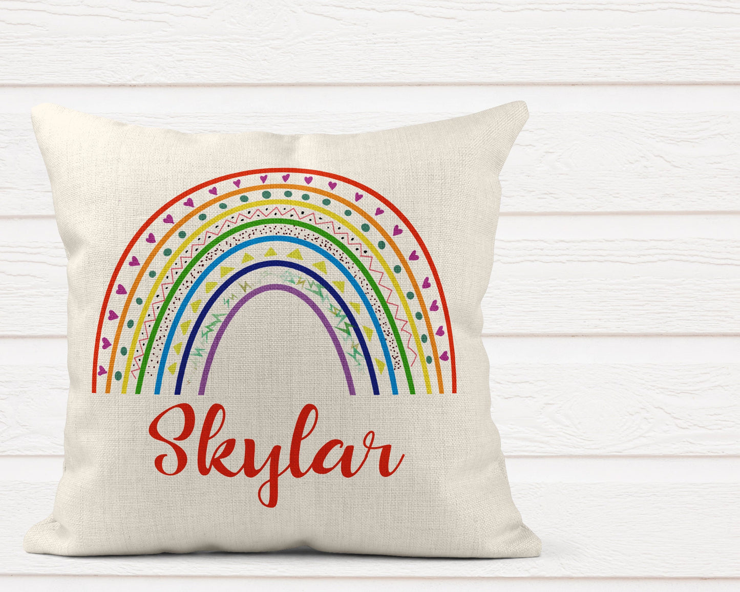 Personalised rainbow cushion pillow with colourful hand-drawn rainbow design and custom name for kids