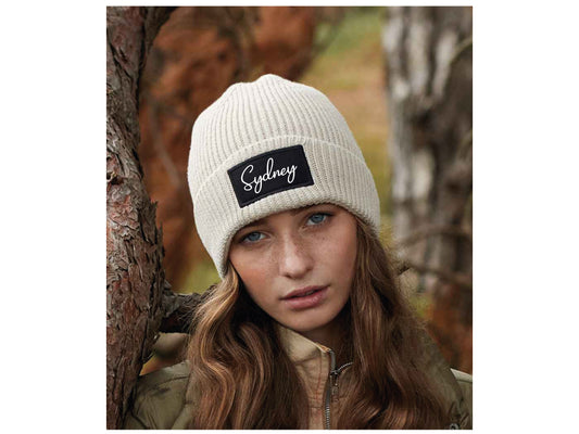 Custom beanie hat with personalised text in ribbed knit cuffed design