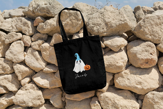 Halloween trick-or-treat bag showing blue and pink ghost hat options