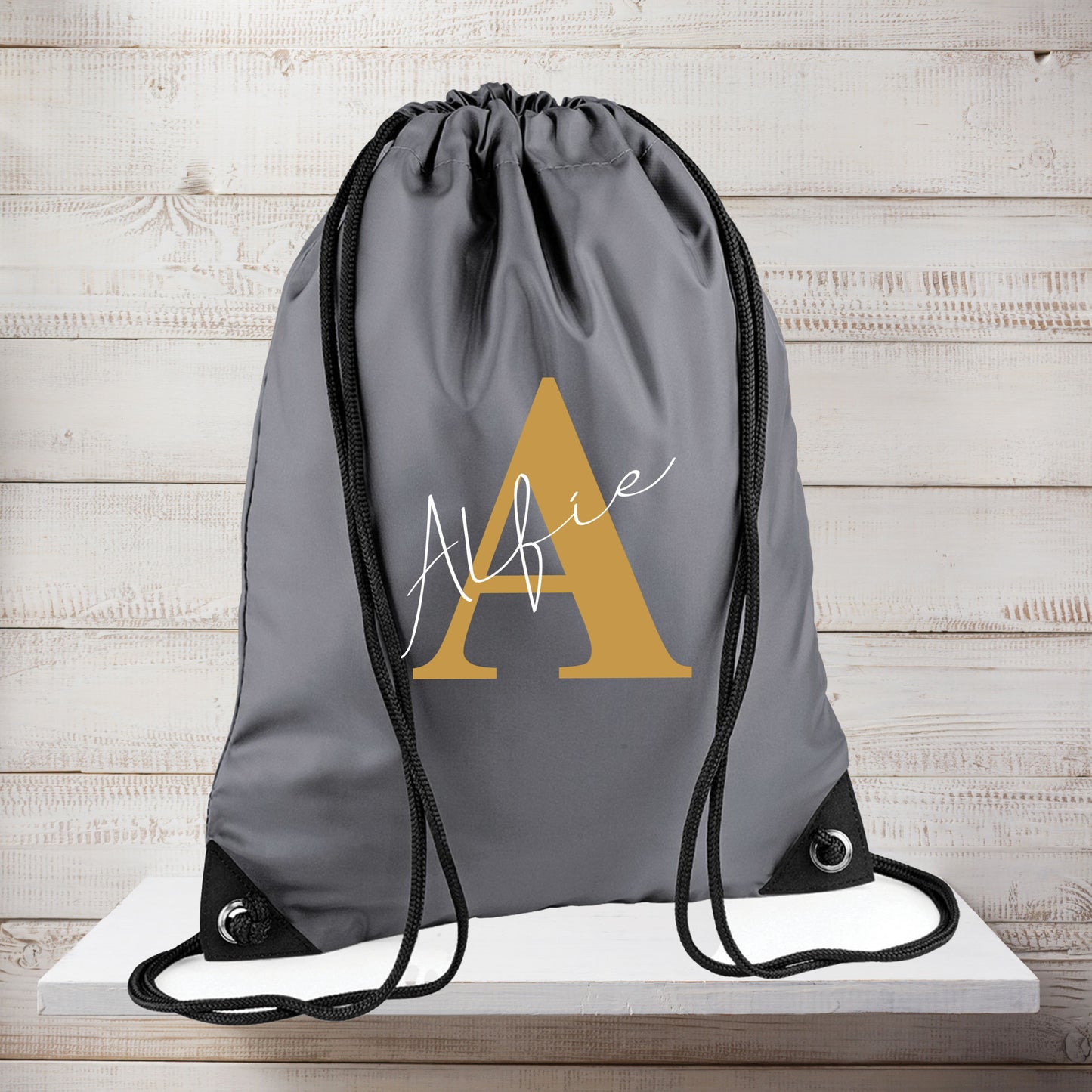 Water-resistant drawstring PE bag with personalised initial detail