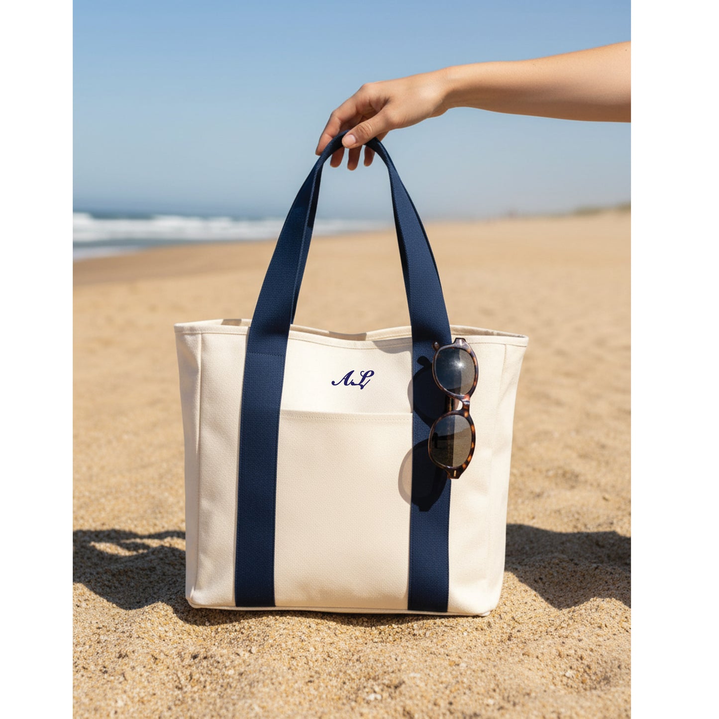 Embroidered tote showing zip closure and 25L capacity