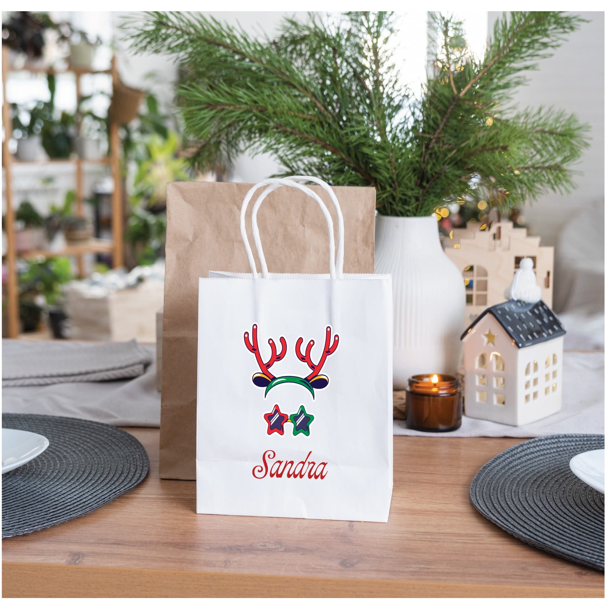 Personalised reindeer Christmas gift bag with custom name on paper bag