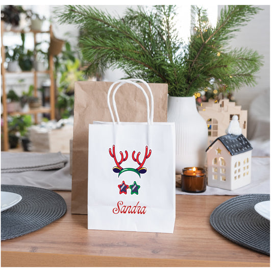 Personalised reindeer Christmas gift bag with custom name on paper bag