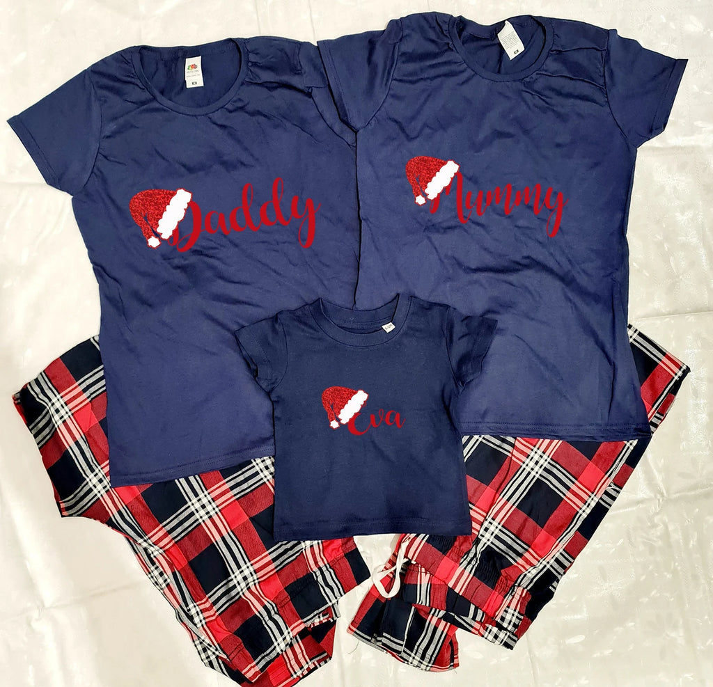 Personalised Santa Hat Christmas Pyjamas set. Set comprises of Navy Blue t-shirt and red tartan pants