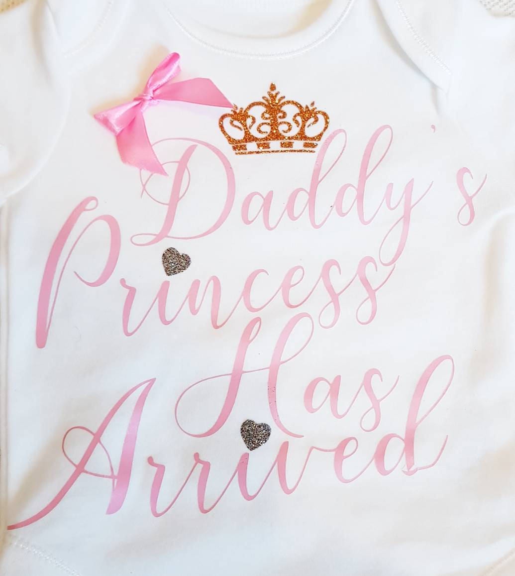 Daddy's Princess Has Arrived baby bodysuit displayed flat showing full front design with bow