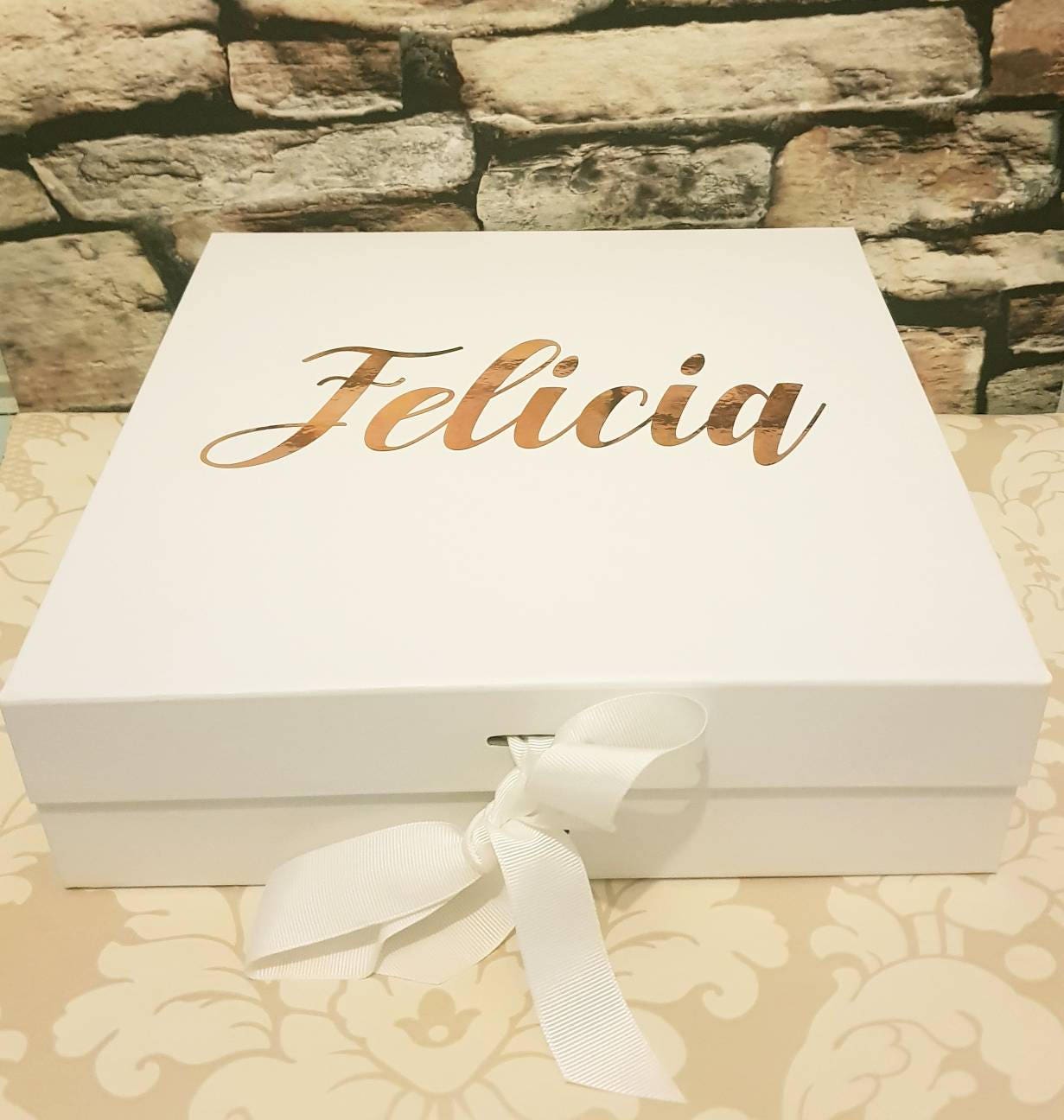 Close-up of self-adhesive vinyl personalisation on luxury magnetic gift box for bridal party