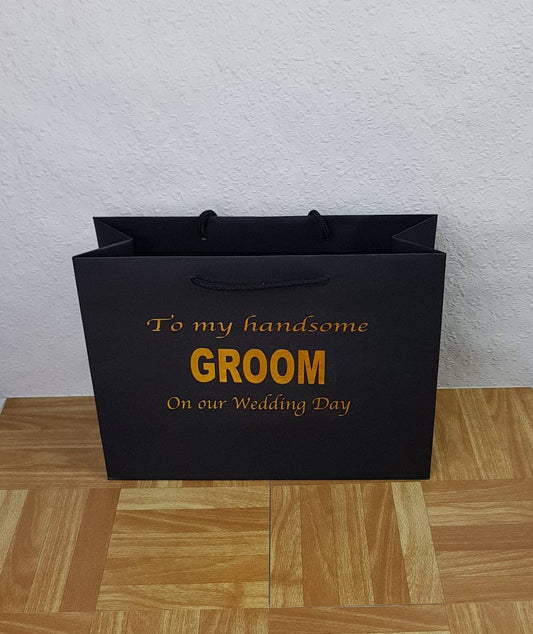 Personalised black groom gift bag with matt finish and custom vinyl name