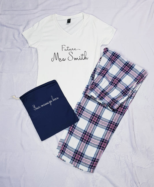Personalised tartan pyjamas set with white t-shirt, tartan trousers and navy personalised pouch