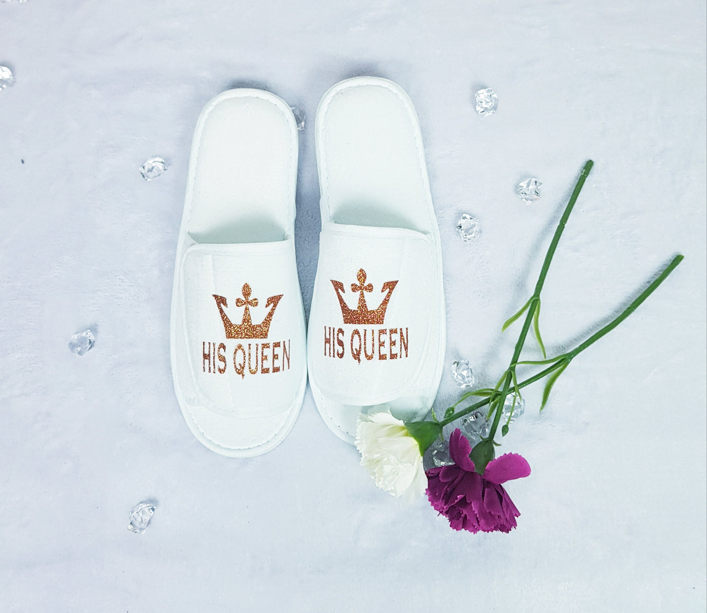 Close-up of Her King navy blue spa slipper with gold crown design and text