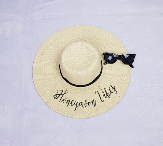 Honeymoon Vibes black floppy beach hat with custom vinyl text, perfect honeymoon accessory for brides