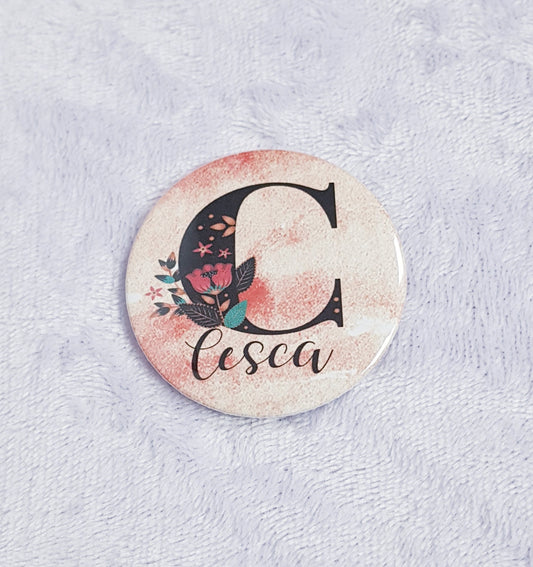 Close-up of personalised initial design on compact pocket mirror, 5.8cm diameter