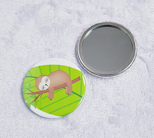 Cute sloth compact pocket mirror showing adorable sloth design on front, 5.8cm diameter