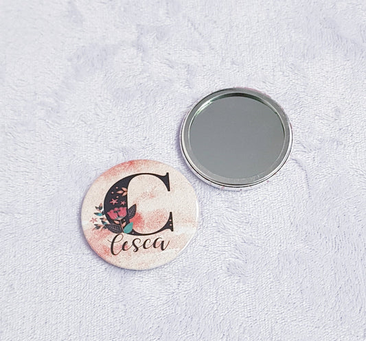 Personalised compact pocket mirror with elegant initial design and custom background colour