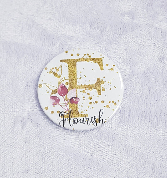Gold floral initial pocket mirror showing front design and back mirror surface