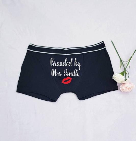 Personalised groom boxer shorts in black with bride's name and lipstick kiss design, fun wedding gift