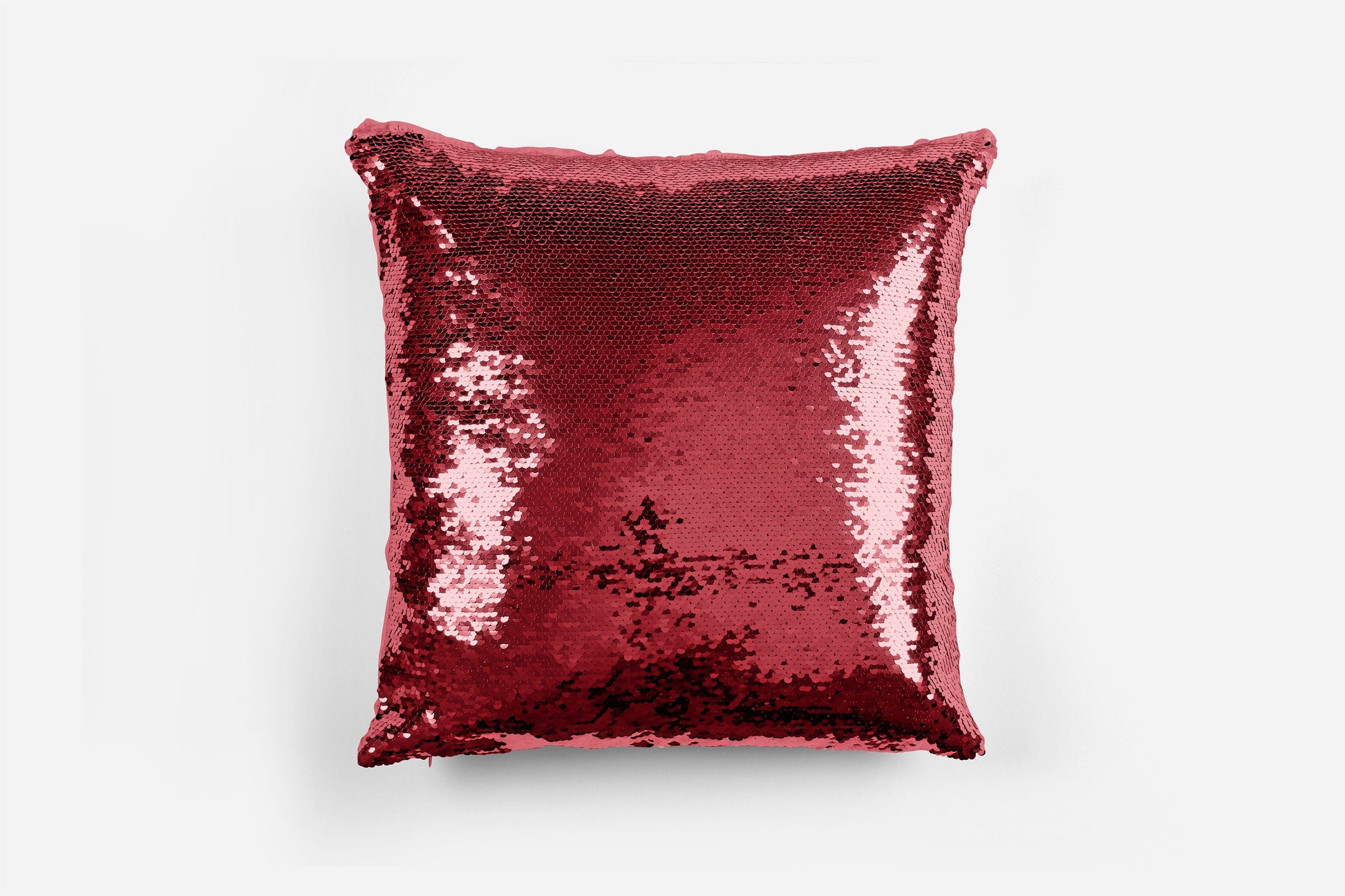 Personalised sequin reversible cushion showing sequin swiping to reveal custom text