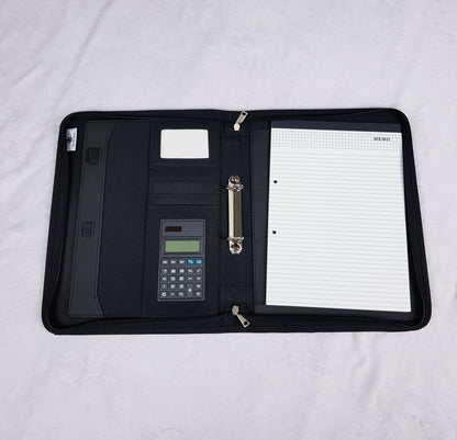 Interior of personalised portfolio organiser showing card slots, ring binder, calculator and writing pad