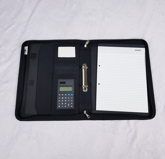 Interior of personalised portfolio organiser showing card slots, ring binder, calculator and writing pad