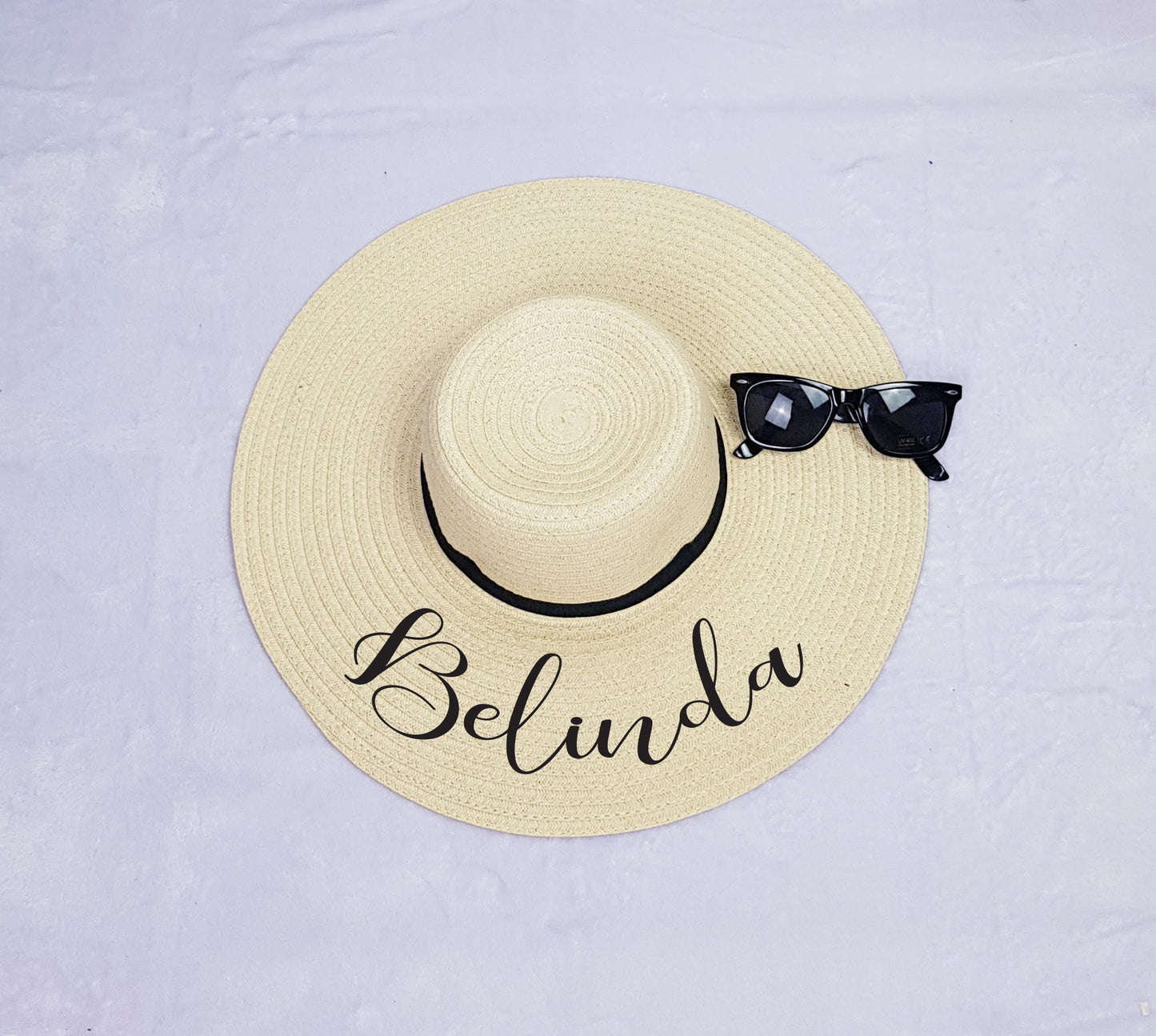 Personalised black floppy beach hat with custom text, stylish sun hat for holidays and hen parties