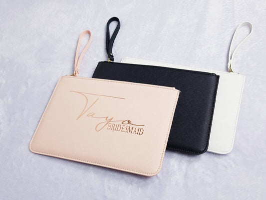 Personalised pink leather-look bridal clutch bag with custom name and role for bridal party