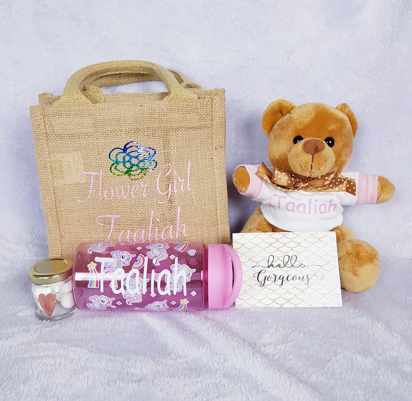 Contents of personalised flower girl gift set laid out showing each item included in the set