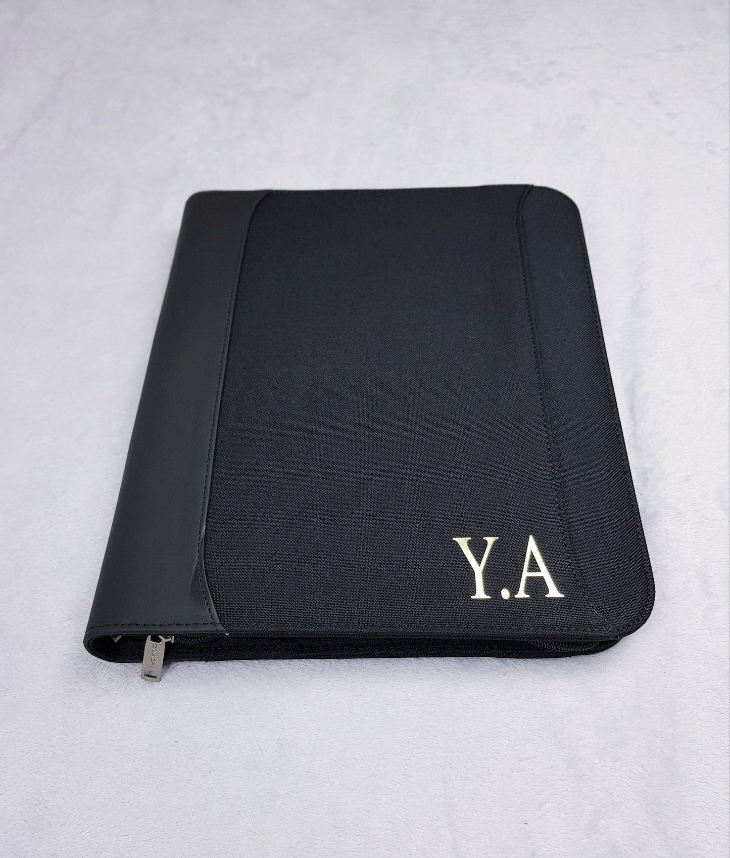 Personalised A4 portfolio organiser with gold foil monogram initials on black zippered cover