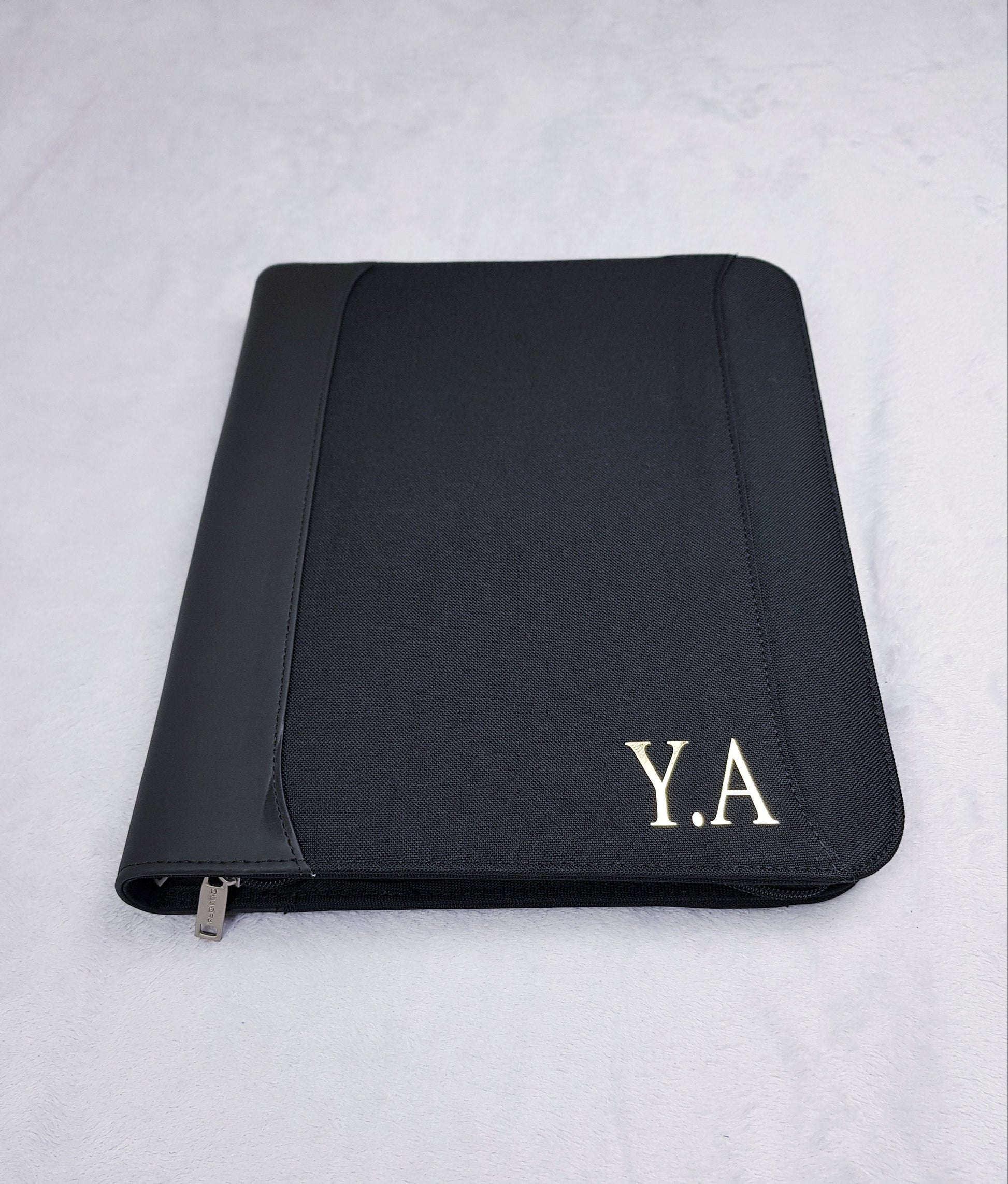 Personalised A4 portfolio organiser with gold foil monogram initials on black zippered cover