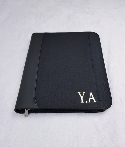 Personalised A4 portfolio organiser with gold foil monogram initials on black zippered cover