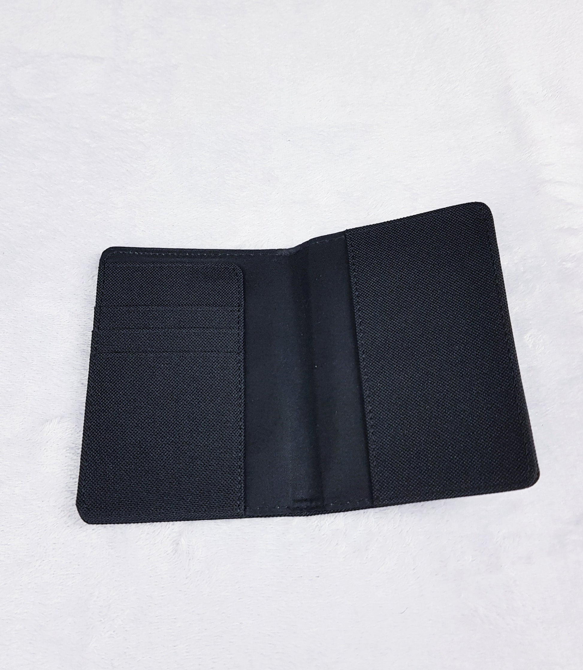 Interior of personalised passport holder showing 3 card slots and passport pocket