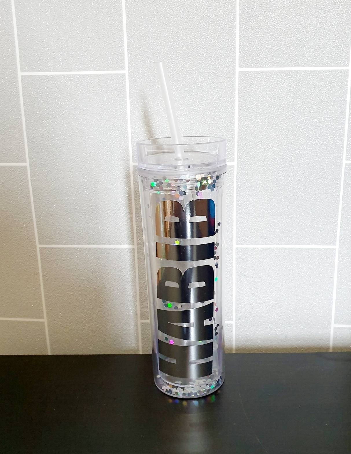 Close-up of personalised name on gold glitter skinny tumbler