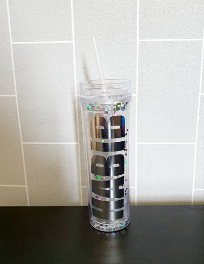 Close-up of personalised name on gold glitter skinny tumbler