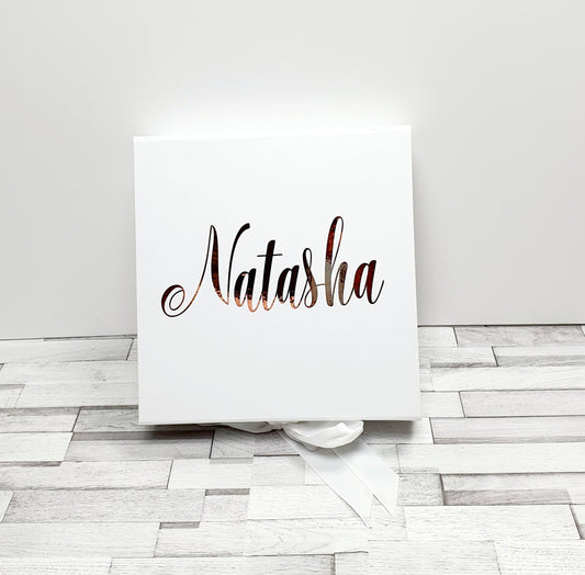 Contents of personalised gift box showing Himalayan bath salts and scented candle