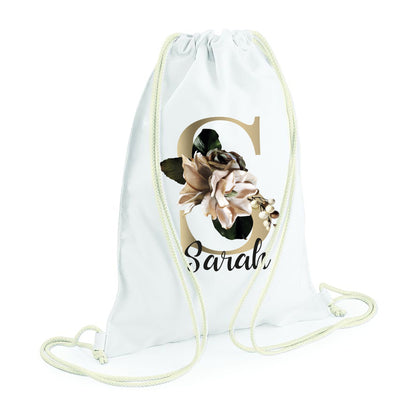 Personalised white drawstring bag with floral monogram design and name personalisation