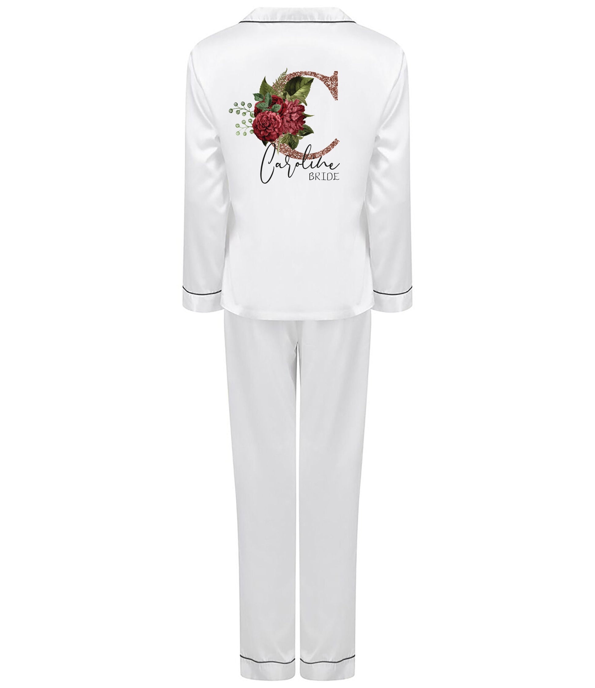 Personalised white satin bridal pyjama set with rose gold floral initial and name, folded and styled for display