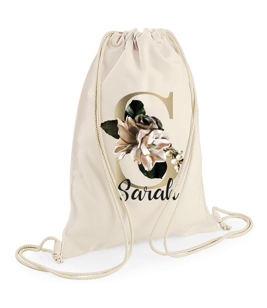 Personalised natural cotton drawstring bag with floral monogram and custom name for flower girls