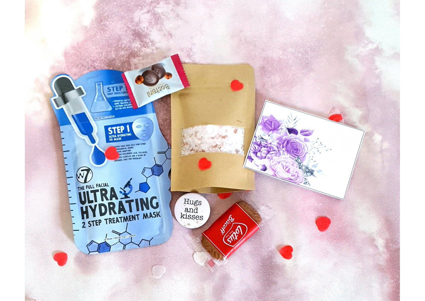 Contents of pamper letterbox set showing lavender bath salt and personalised gift card