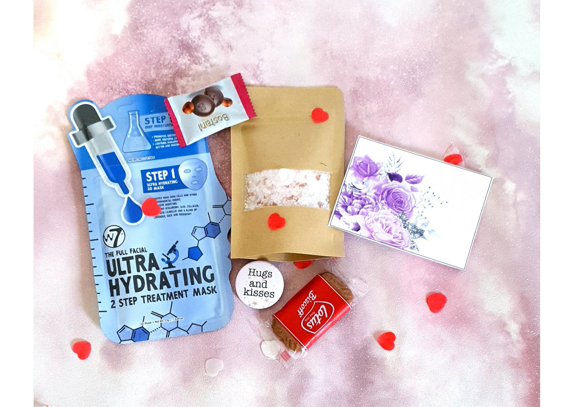 Contents of pamper letterbox set showing lavender bath salt and personalised gift card