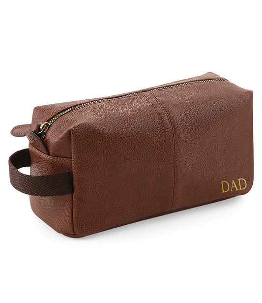 Personalised tan leather-look wash bag showing interior pinstripe lining and pockets