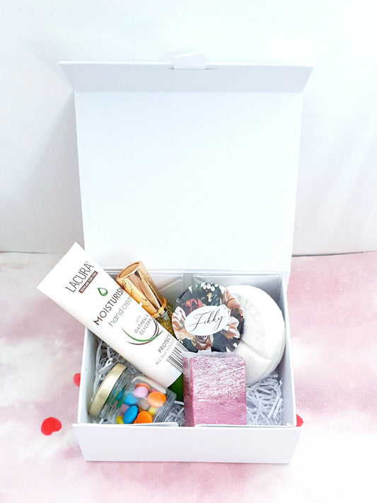 Rose gold personalised filled gift box with compact mirror, shower mixer, nail polish and treats