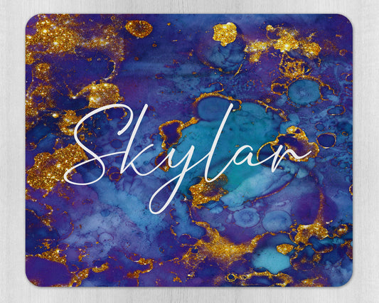 Close-up of personalised name detail on purple and gold grunge design mouse pad with rubber base