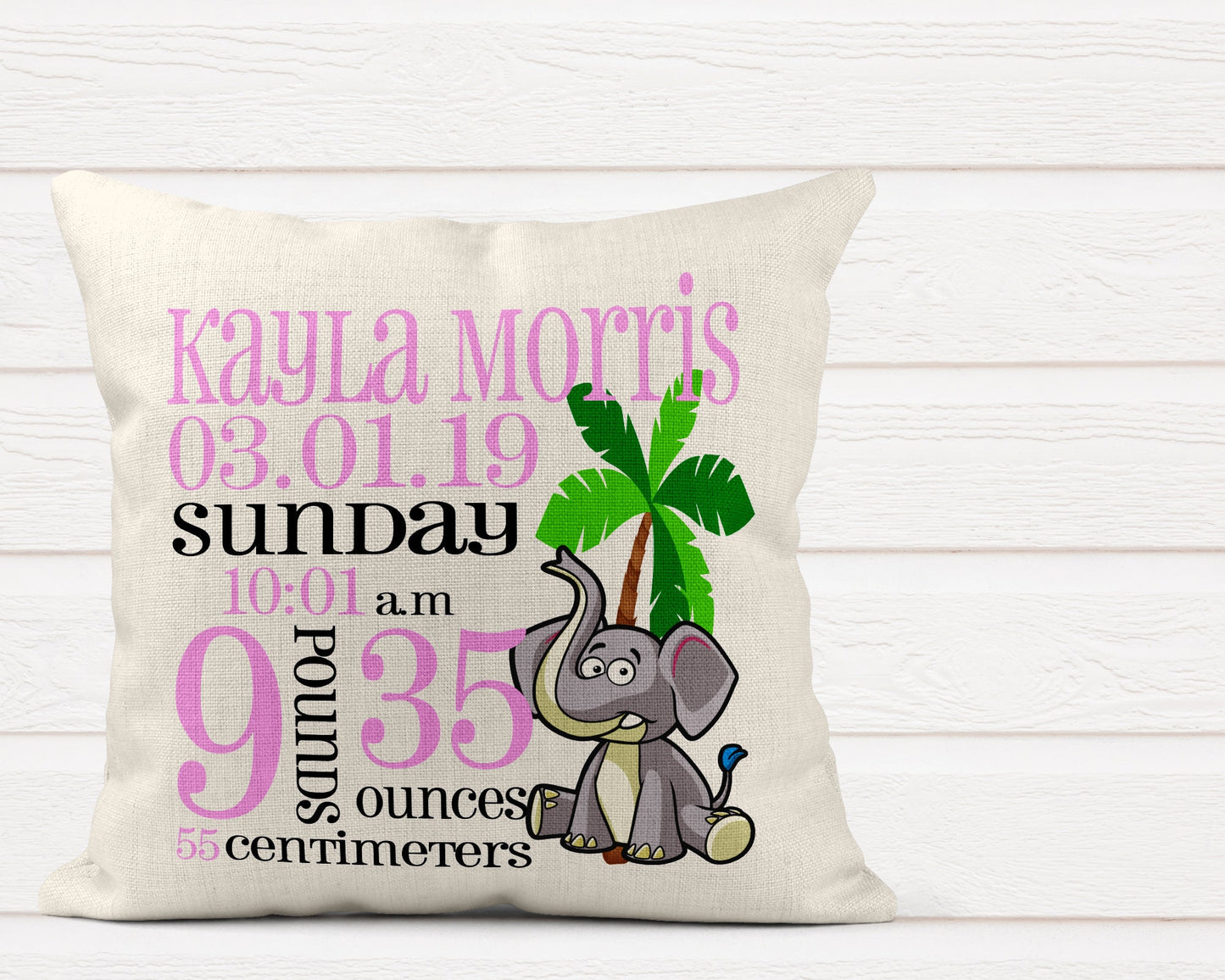 Personalised baby birth announcement cushion with name, date, weight and time next to cute animal design