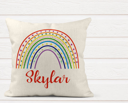 Personalised rainbow cushion pillow with colourful hand-drawn rainbow design and custom name for kids