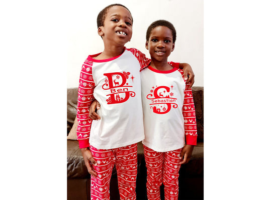 Personalised matching family Christmas pyjamas displayed together with festive monogram design