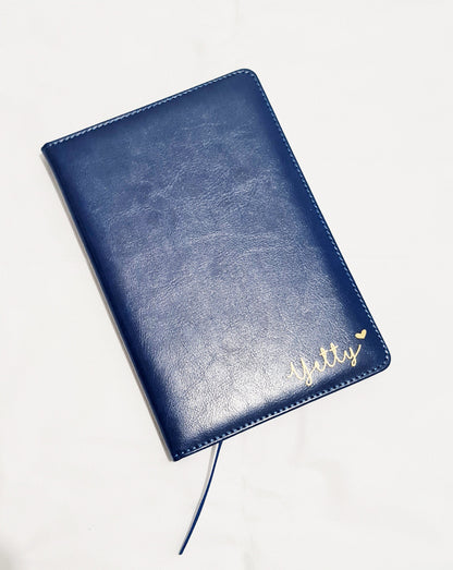 Interior of personalised A5 notebook showing lined pages and satin page divider