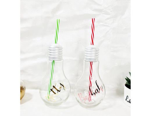 Personalised bauble-shaped gin glass with custom name and striped straw, festive novelty gift