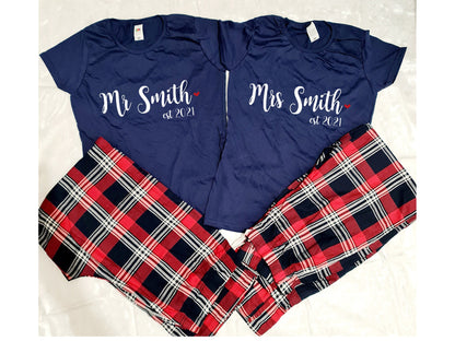Personalised Mr and Mrs matching couple's tartan pyjama sets displayed together with custom names